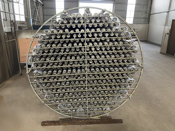 Multiple asymmetric metal membrane filter elements assembled in a circular frame within a factory.