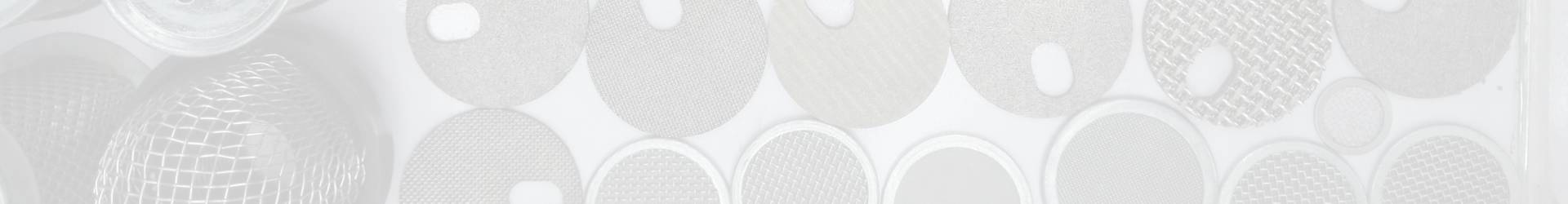 Various sintered metal filter elements are displayed in various shapes and sizes.