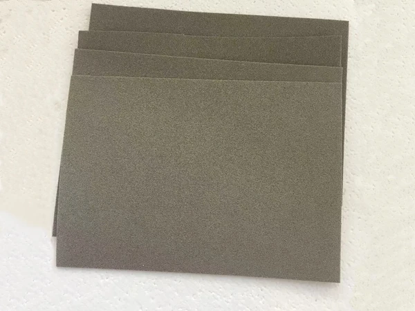 Four pieces of rectangular nickel foam placed on the table