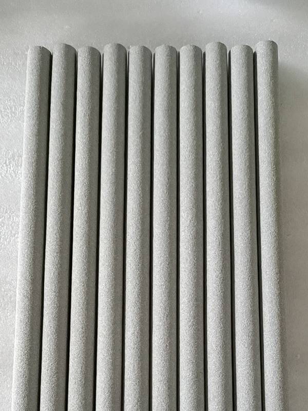 10 sintered powder filter elements placed on a flat plate