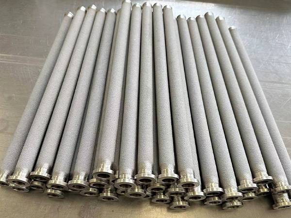 Multiple sintered porous filter elements stacked together