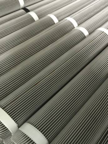 A large number of sintered mesh filter elements are neatly placed.